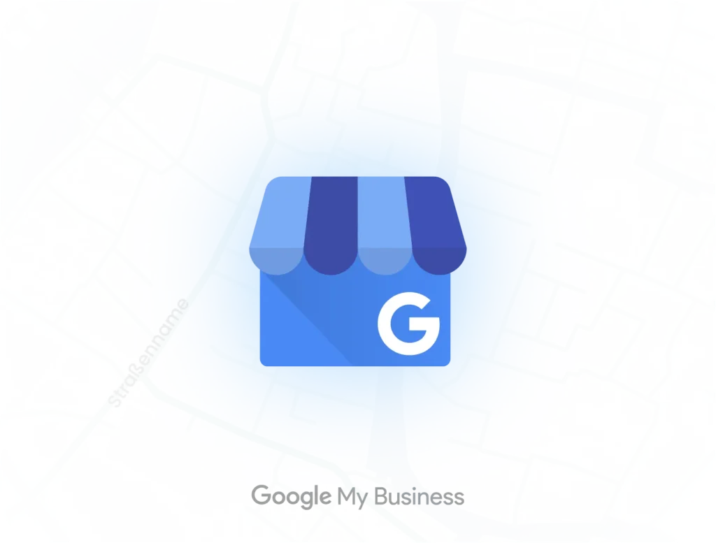 Google My Business-Icon auf einer Karte. Das blaue Symbol mit einem Geschäftsdach und dem Buchstaben 'G' zeigt die Google My Business-Plattform, die Unternehmen ermöglicht, ihre Präsenz in Google Maps und der Google-Suche zu verwalten.
